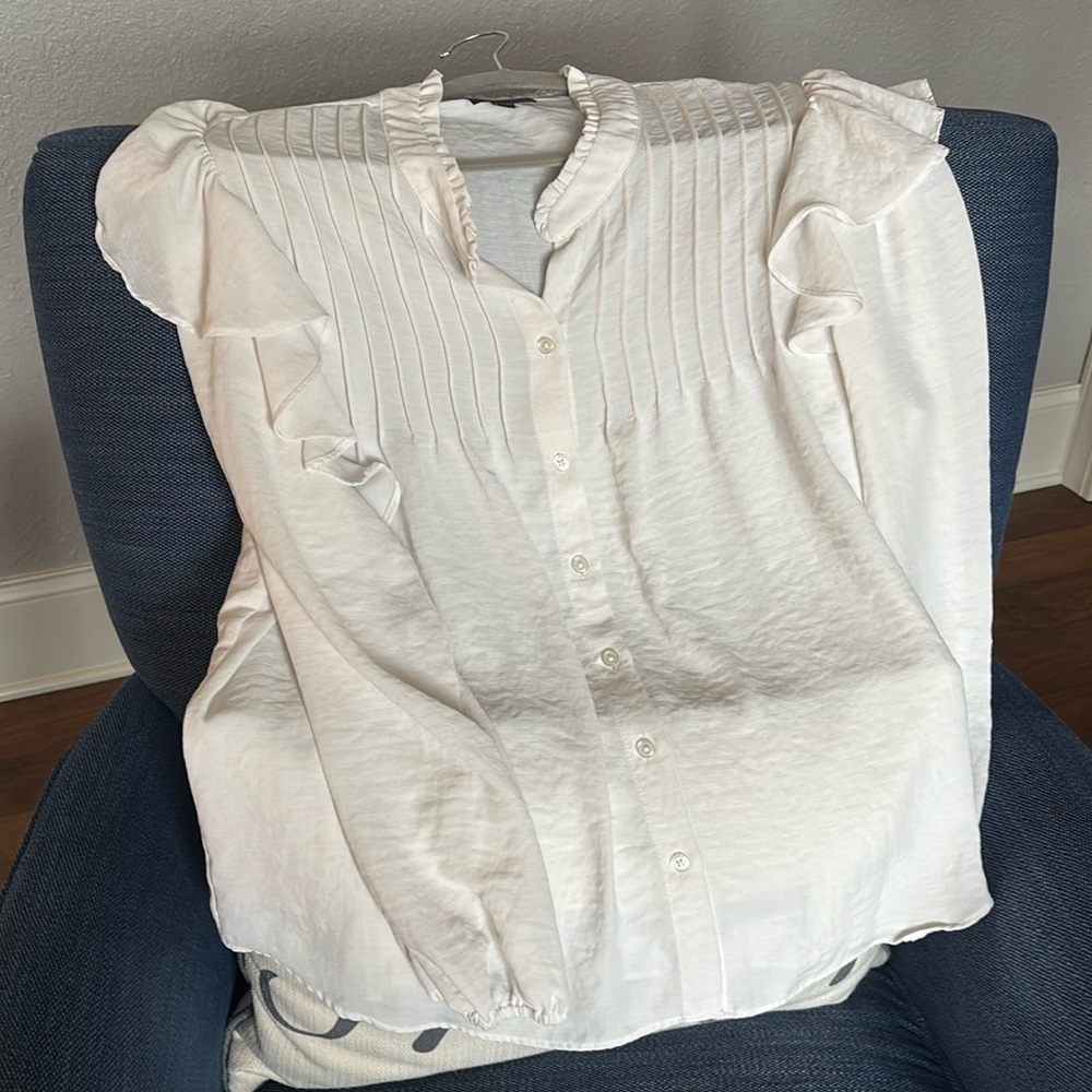 Beautiful feminine off-white peasant-style blouse. Long sleeved.